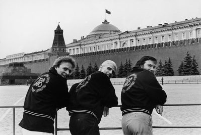 David Pountney's Opera Career Three men stand side-by-side with leather jackets.
