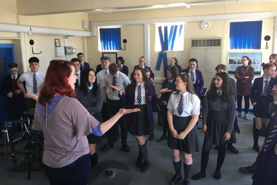 A classroom of children and a teacher