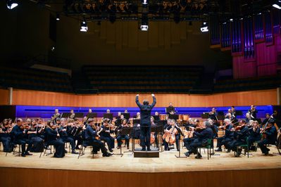 Gi J WNO Orchestra 145 View of the conductor and orchestra on stage.