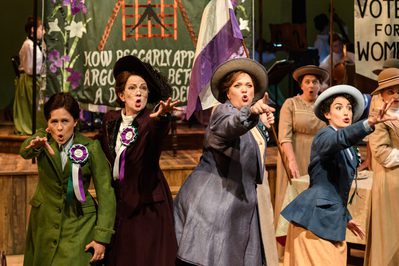 WNO RRIU Catherine Wood Lottie Rosie Hay Sybil Madeleine Shaw Lady Rhondda and Paula Greenwood Prid Photo credit © Jane Hobson 7172 Jane Hobson 2018 Rhondda and friends appear passionate, reaching out and pointing to the audience.