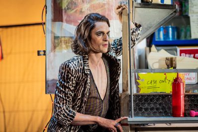 WNO Don Pasquale Quirijn de Lang Malatesta Photo credit Robert Workman 093 Robert Workman 2019 Man leaning against burger van in leopard print jacket.