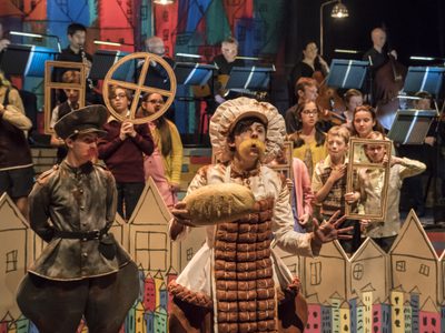 WNO Brundibar Josh Stanbury Policeman Sophie Perry Ice cream man WNO Youth Opera Photo credit Johan Persson 00235