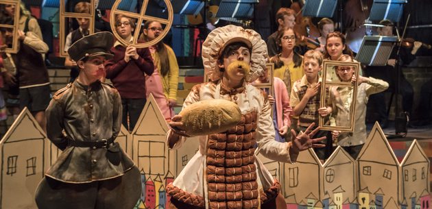 WNO Brundibar Josh Stanbury Policeman Sophie Perry Ice cream man WNO Youth Opera Photo credit Johan Persson 00235