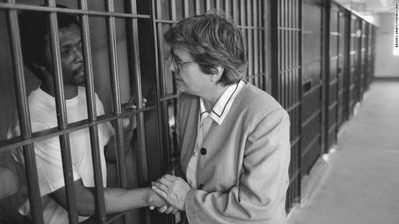 helen prejean BW Helen Prejean cups a prisoner's hands through the bars.