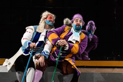 WNO La Cenerentola Giorgio Caoduro Dandini Fabio Macchioni Don Manifico Photo credit © Jane Hobson 2203 Jane Hobson Dandini and Don Magnifico sit side by side in their colourful robes.