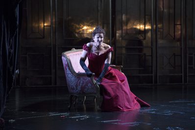 WNO La traviata Linda Richardson Violetta Photo credit Betina Skovbro 3743 Betina Skovbro Violetta sits in a large chair.