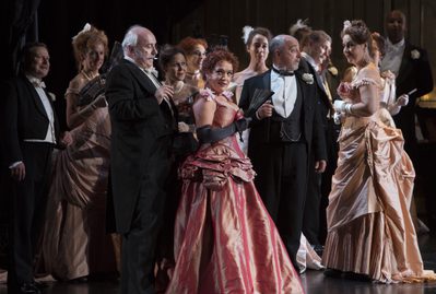 WNO La traviata Philip Lloyd Evans Marquis d Obginy Rebecca Afonwy Jones Flora and WNO Chorus Photo credit Betina Skovbro 3598 Betina Skovbro