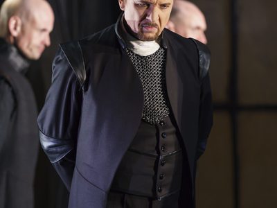 WNO Roberto Devereux George Newton Fitzgerald Page Photo credit Bill Cooper 0503 Bill Cooper 2019 Man in formal jacket looking downwards and upset.