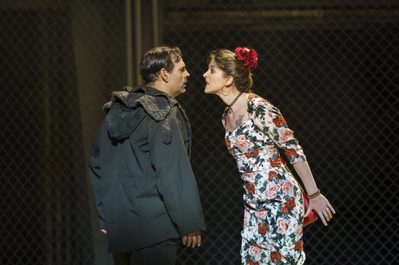 WNO Carmen Dimitri Pittas Virginie Verrez Photo Credit Bill Cooper 1370 Woman leans forward to speak angrily to a man arms behind her.