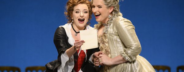 WNO The Marriage of Figaro Soraya Mafi Susanna and Anita Watson Contessa d Almaviva Photo credit Richard Hubert Smith2217 Richard Hubert-Smith 2020 Two women looking at a letter smiling.