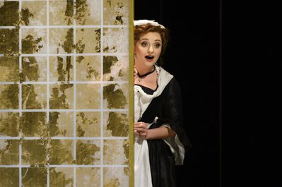 WNO The Marriage of Figaro Soraya Mafi Susanna Photo credit Richard Hubert Smith1747 Richard Hubert-Smith 2020 Maid peering around the side of a wall looking slightly shocked.