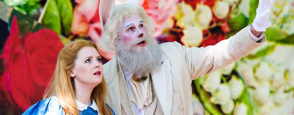 Image from production commissioned and originally produced by Opera Holland Park Photo credit Alex Brenner 1 Alex Brenner Side by side, Alice and White Rabbit look onwards, towards Wonderland