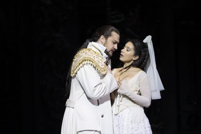 WNO Don Giovanni Andrei Kymach Don Giovanni Isabelle Peters Zerlina photo credit Bill Cooper 0853 Don Giovanni, in white coat, seduces Zerlina, in wedding dress