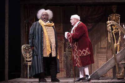 WNO The Barber of Seville Keel Watson Basilio Andrew Shore Dr Bartolo photo credit Richard Hubert Smith 4851 Basilio singing looking towards the audience alongside Dr Bartolo