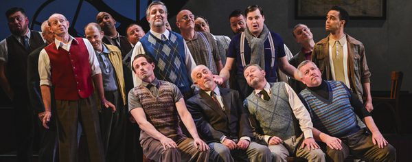 WNO Blaze of Glory Cast of Blaze of Glory photo credit Kirsten Mcternan 215 male voice choir lean in their chairs during a rehearsal