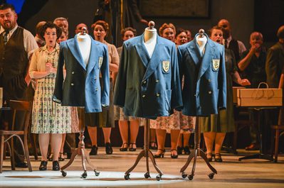 WNO Blaze of Glory Cast of Blaze of Glory photo credit Kirsten Mcternan 514 Blazers for a glee club are hung on the fitting manequin