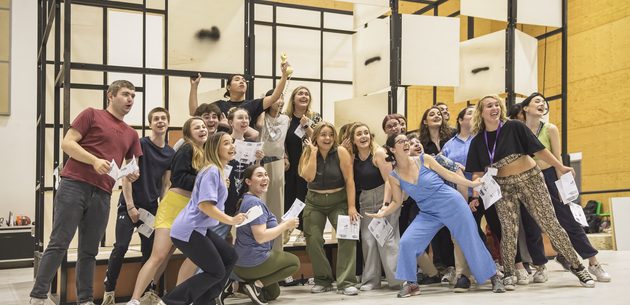 WNYO Cherry Town Moscow Cast photo credit Craig Fuller 11 youth opera cast pose before a mock up of the set
