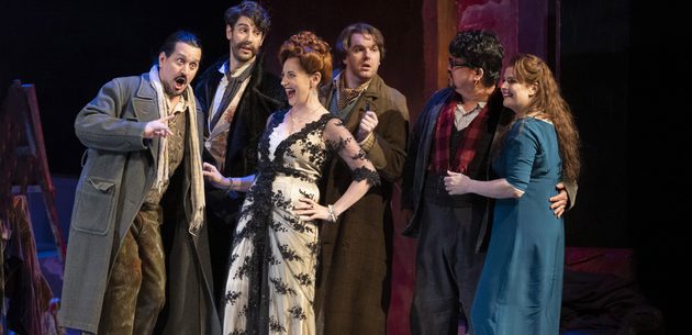 WNO La bohème Cast of La bohème photo credit Richard Hubert Smith 0032 a group of friends have a laugh and enjoy each other's company