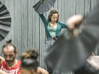 WNO Ainadamar Flamenco dancers photo credit Craig Fuller 6308 A flamenco dancers in rehearsal waves her fan
