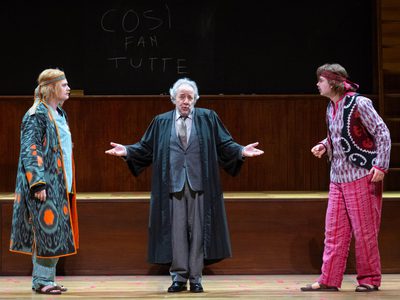 WNO Così fan tutte Egor Zhuravskii Ferrando José Fardilha Don Alfonso James Atkinson Guglielmo photo credit Elliott Franks 6119 Production shot in which Don Alphonso stands with his arms out between Gugliemo and Ferrando