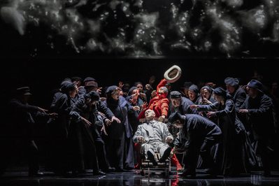 WNO Death in Venice Roderick Williams The Voice of Dionysus Mark le Brocq Gustav von Aschenbach and the Cast of Death in Venice photo credit Johan Persson 07449