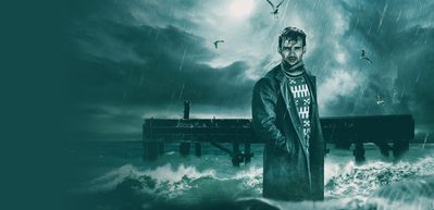 CL2189 S25 Web image 1000x486 Cover PGrimes A dramatic poster image of a rugged Peter Grimes stood in the sea during a wild storm. He wears a wool jumper and coat, and around him waves crash and birds fly amongst thick clouds and rain.